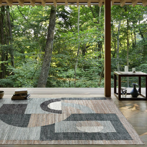 An elegantly designed premium rug gracing a modern living space.