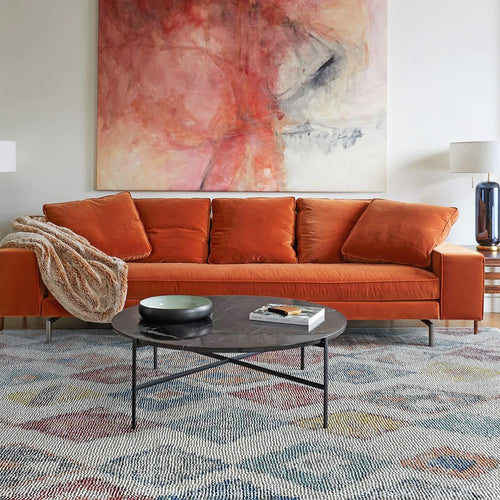 A beautifully designed premium rug in a modern living room.