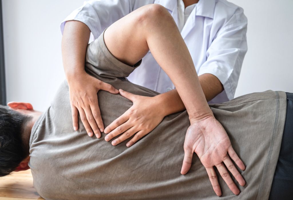 Doctor or Physiotherapist working best osteopathic treatment